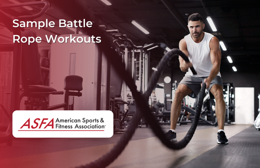 A man working out with battle ropes in a gym.
