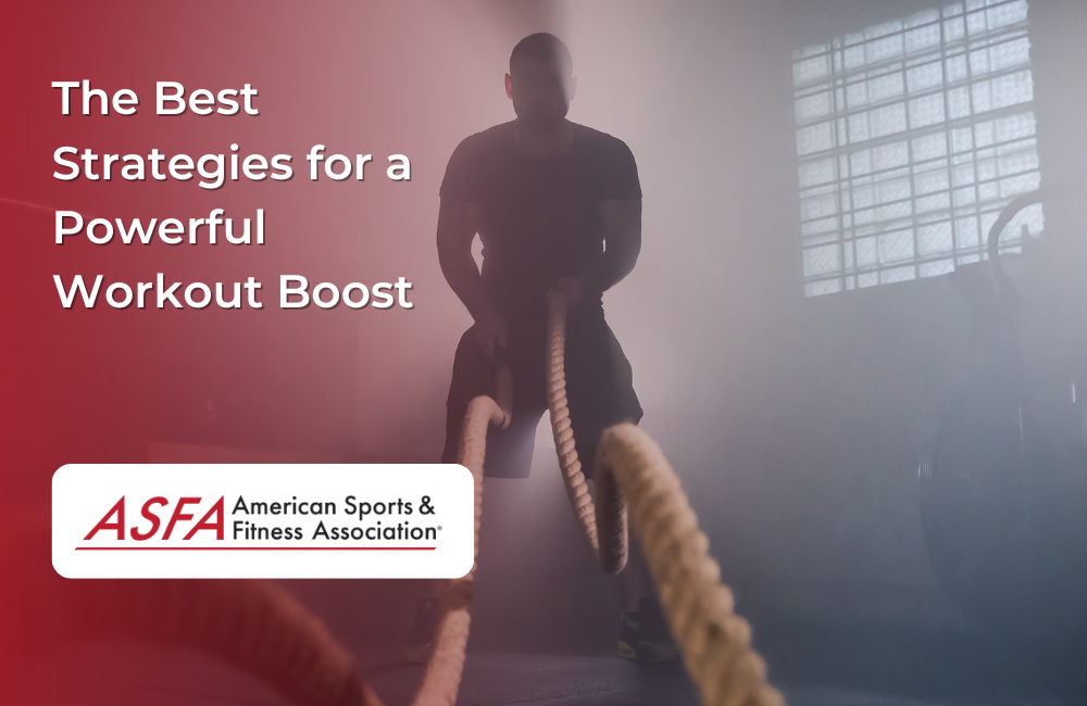 A man in a dim gym performing battle rope exercises in a misty atmosphere.