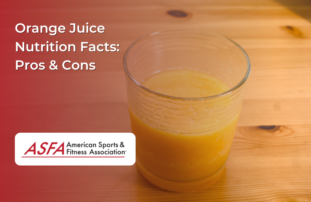 A glass of orange juice sitting on a wooden table