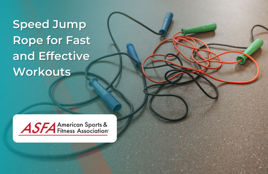 Several jump ropes with colorful handles lie tangled on a gym floor.