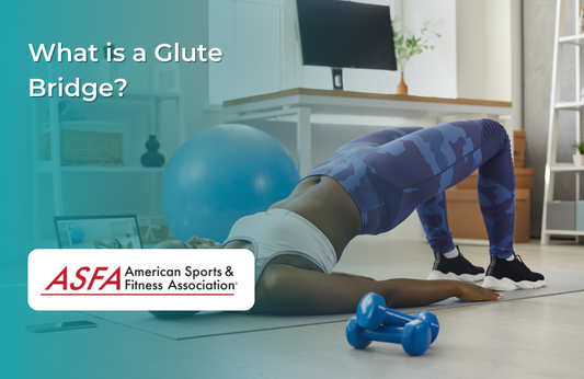 A woman in blue workout leggings does a glute bridge exercise in a home setting with dumbbells nearby.