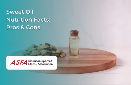 A small glass bottle of oil on a wooden board, surrounded by almonds.