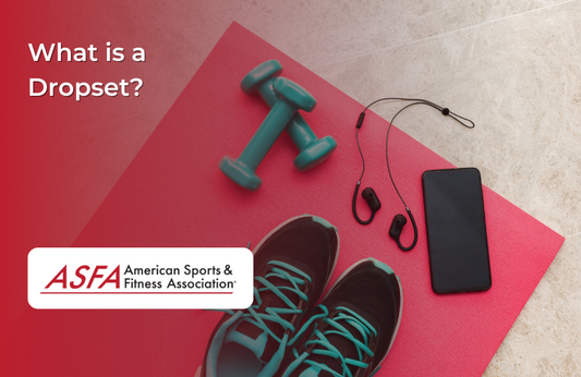 A pink fitness mat with shoes, phone, and dumbbells.