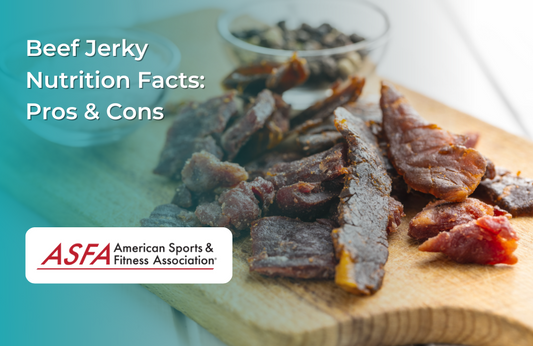 Slices of beef jerky on a wooden board with scattered peppercorns.