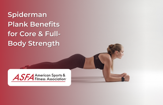 A woman in athletic wear holds a forearm plank on a plain studio floor.