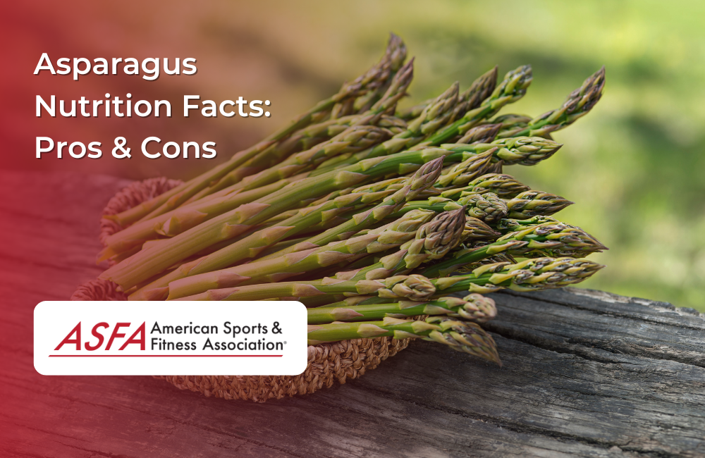 A bundle of fresh green asparagus spears laid out on a rustic wooden surface with a blurred outdoor background.