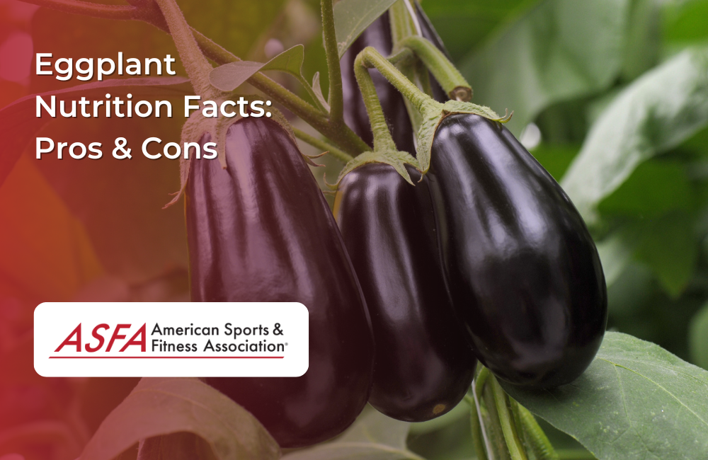 Three glossy eggplants hanging from a vine in a garden setting.