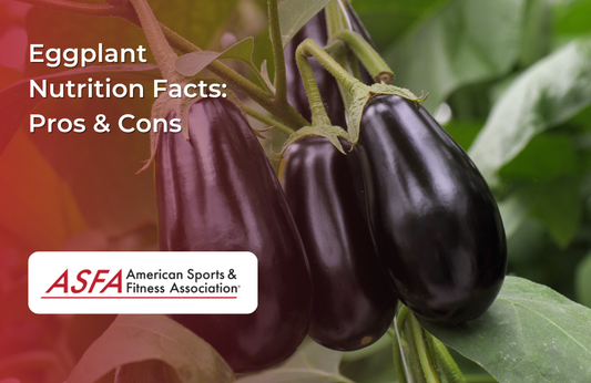 Three glossy eggplants hanging from a vine in a garden setting.