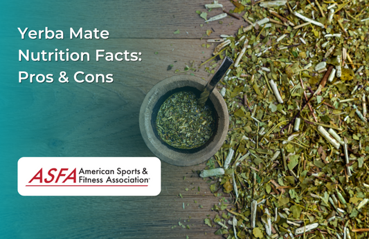 A traditional yerba mate drink in a wooden bowl with a metal straw, surrounded by dried leaves.