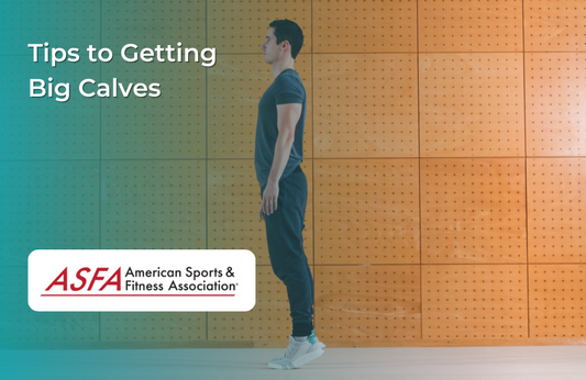 A man performing a calf raise exercise while standing against a wall in a gym.