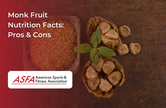 Whole monk fruits and a bowl of granulated monk fruit sweetener on a dark brown background.