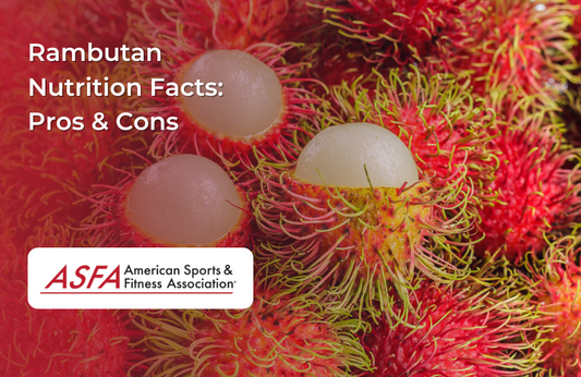 Bright red rambutans with hairy skin, one peeled to reveal the translucent fruit inside.