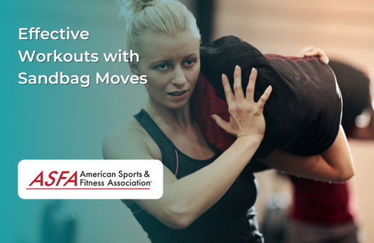Woman lifting a sandbag onto her shoulder during an intense workout in a gym