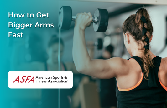Lady doing shoulder presses with dumbbells in a gym.