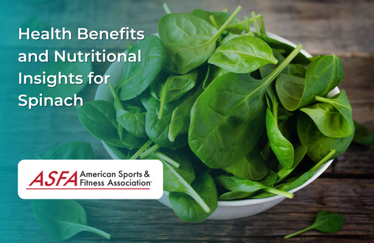 A white bowl filled with fresh spinach leaves placed on a rustic wooden table.