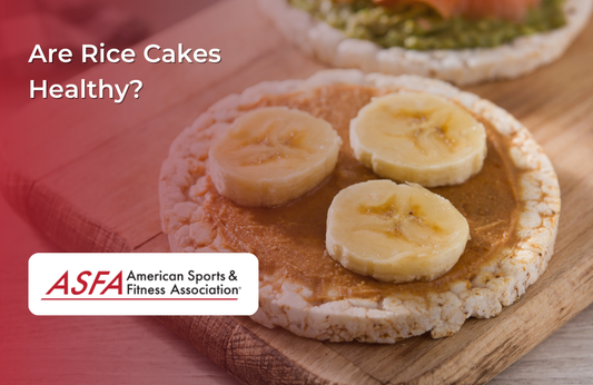 Rice cakes topped with peanut butter and banana slices on a wooden surface.