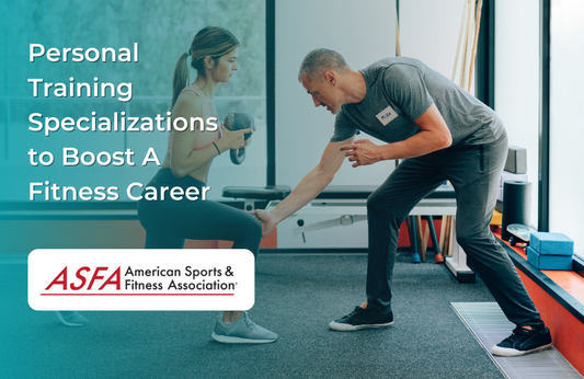 A trainer guides a woman holding a dumbbell during a workout in a modern gym.