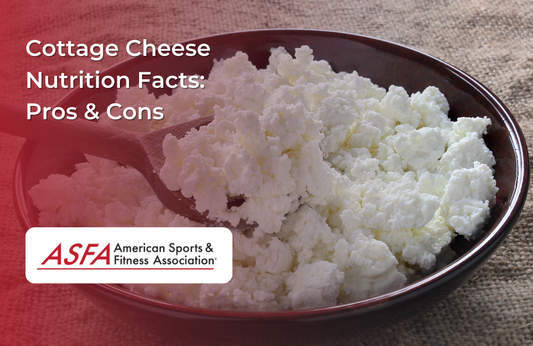 A wooden spoon in a bowl of fresh cottage cheese.