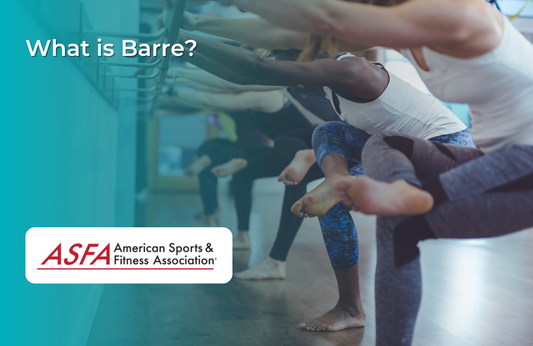 Group of people doing barre exercises.