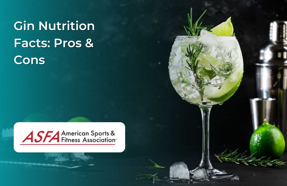 A glass of gin with ice, lime wedges, and a sprig of rosemary, with a dark cocktail-making setup in the background.