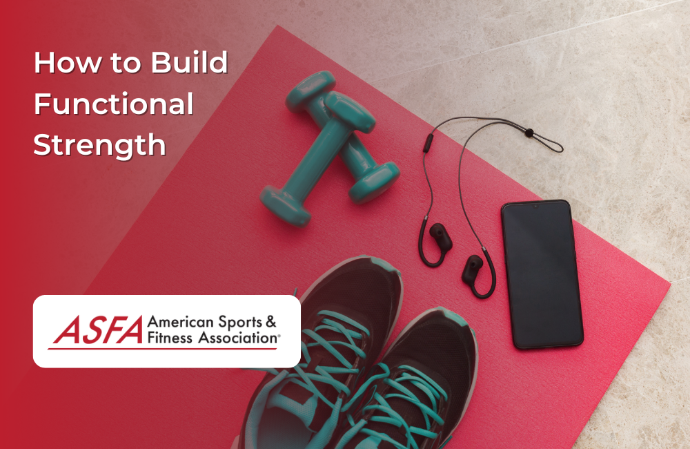 Fitness equipment such as teal dumbbells, black headphones, a black smartphone, and black and blue tennis shoes on a dark pink mat.