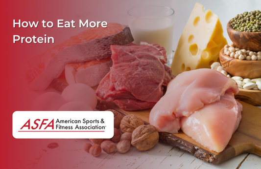 Plate of nuts, chicken, and beef with a block of cheese and a glass of milk behind it.