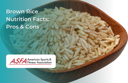 A wooden bowl filled with uncooked brown rice grains.