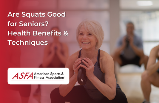 A woman smiling while doing squats with a kettlebell in a group class.