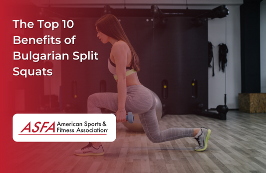 A woman in exercise clothes doing squats while holding blue dumbbells inside.