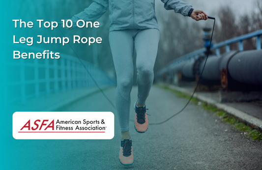 Someone in a gray tracksuit and orange running shoes, jumping rope outside.