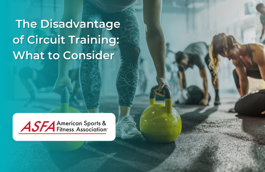 A group of people working out in a gym with someone in the forefront using yellow kettlebells.  